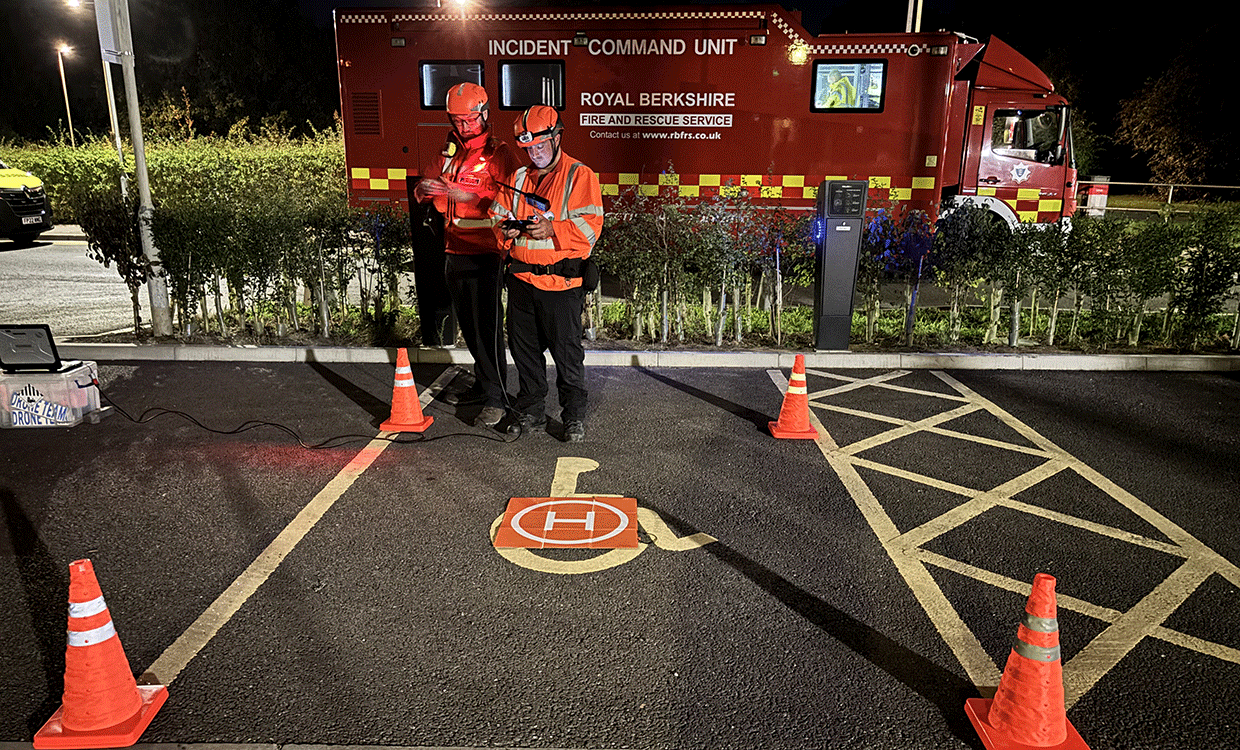 Drone pilot and spotter at simulated high rise building fire