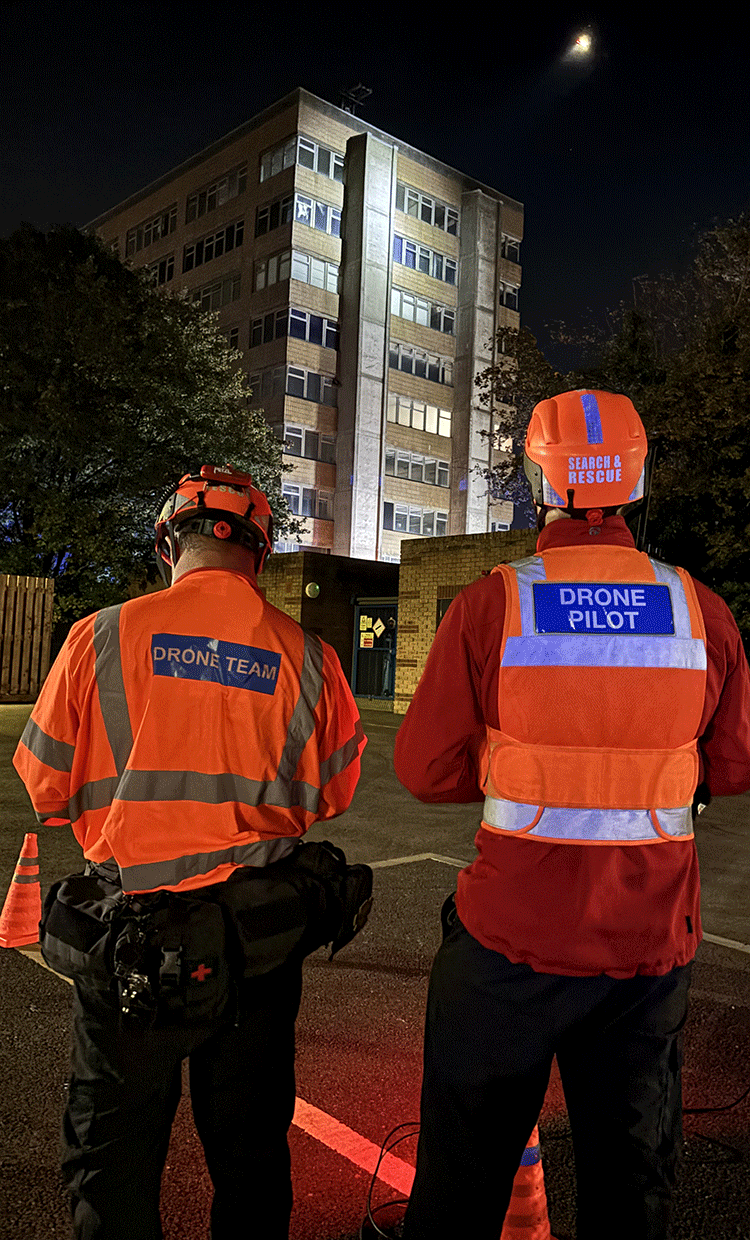 Drone pilot and spotter at simulated high rise building fire